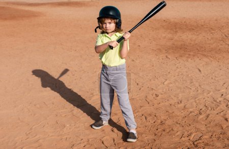 Photo for Kid holding a baseball bat. Pitcher child about to throw in youth baseball - Royalty Free Image