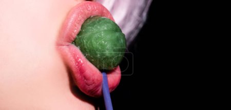 Photo for Sucking lips. Mouth licking lollipop, red female glossy lips and pink candy lollipop - Royalty Free Image