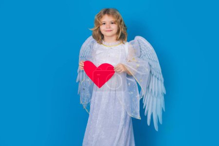 Photo for Love and valentines day symbol. Valentines card for Valentines Day. Valentine design. Happy Valentine. Child with angel wings hold paper heart. Symbol love and valentines day - Royalty Free Image