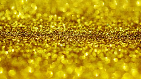 Foto de Fondos dorados brillo. Bokeh luz dorada para diseñar. Glitter fondos dorados para el día de San Valentín, cumpleaños o tarjetas de Navidad. Textura dorada. Bokeh oro claro - Imagen libre de derechos