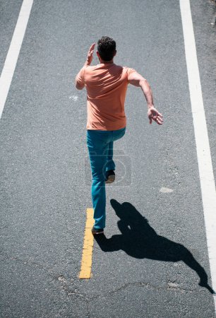 Photo for Man running on the road. Active healthy runner jogging outdoor. - Royalty Free Image