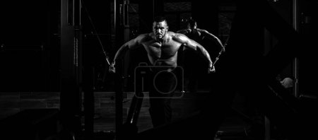 Photo for Banner templates with muscular man, muscular torso, six pack abs muscle. Strong muscular man works out pushing up excercise in gym, exercises at triceps. Crossfit, sport and healthy lifestyle concept - Royalty Free Image