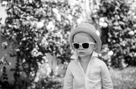 Photo for Adorable cool child boy in sunglasses oudoor. Kids fashion. Boss children - Royalty Free Image