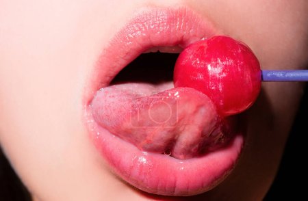 Photo for Licking tongue lips. Lips with candy, sexy sweet dreams. Oral sex blow job concept. Female mouth licks chupa chups, sucks lollipop - Royalty Free Image