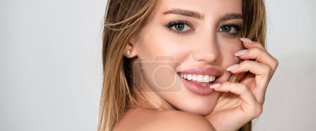 Photo for Beautiful woman with naked shoulder isolated on white. Sensual beauty female model face with white teeth close up. Natural beauty woman. Elegant Lady - Royalty Free Image