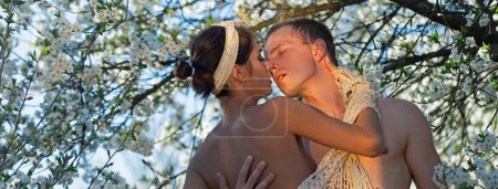 Photo for Couple in love, spring banner. Sensual spring couple. Honeymoon. Cherry blossom tree. Springtime Nature. Love story - Royalty Free Image