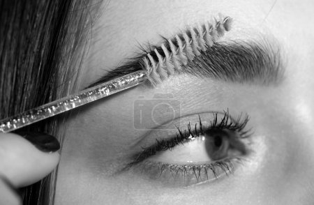 Photo for Eyebrow makeup. Macro close up of brows. Beauty model shaping brows with brow pencil closeup. Beautiful woman contouring eyebrows. Beautiful female eye with perfect shape eyebrows - Royalty Free Image