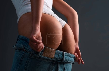 Foto de Female buttocks ass butt without cellulite. Skin treatment. Sexy body, butt in jeans denim - Imagen libre de derechos