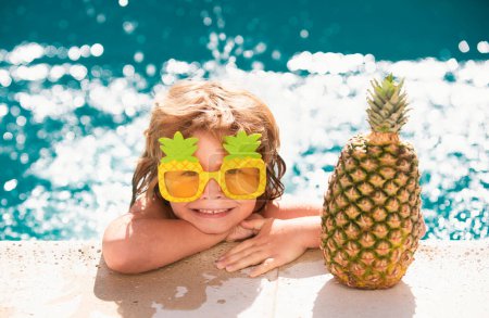 Photo for Children swimming and playing in water, happiness and summertime. Kid summer. Summer pineapple fruit. Funny amazed face - Royalty Free Image