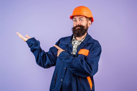 Photo for Builder concept. Builder foreman. Caucasian man worker in helmet. Worker in helmet isolated on studio background. Construction worker in helmet at building. Site manager - Royalty Free Image