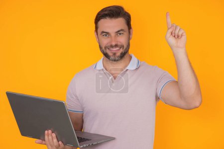 Photo for Entrepreneur working with a laptop. Business man man using laptop computer on studio background. Thoughtful caucasian businessman in eyeglasses looking at computer screen, working online, Freelance - Royalty Free Image