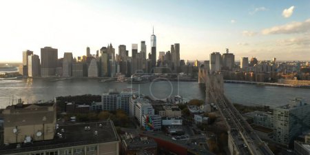 Photo for NY City skyline. Buildings of New York. New York Buildings. Skyline of NYC. Aerial view of Brooklyn Bridge with Manhattan in the background. New York at dusk. New York skyline. Brooklyn Bridge - Royalty Free Image