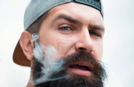 Photo for Hipster man smoking cigarette. Medical cannabis. Smoking habit. Fashionable mature man with cigarette - Royalty Free Image