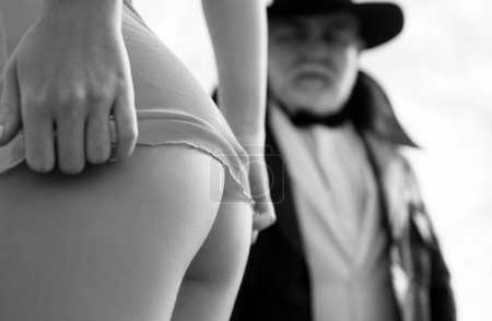 Photo for Stripper club. Closeup young girl butt. Senior mature old man and sexy woman. Prostitute hooker. Sexy lady with sugar daddy. Submission - Royalty Free Image