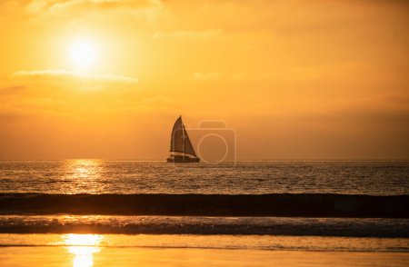 Photo for Sailboat at sea. Seascape golden sunrise over the sea. Yacht sailing in the sunrise time. Sea landscape view with a beautiful sailboat. Yachting tourism sea voyage on the sail boat - Royalty Free Image