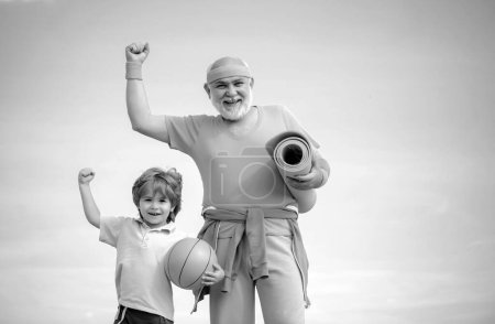 Photo for Body care and healthcare. Fitness and active lifestyle concept - copy space. Senior man and child in family health club. Doing sports is free - Royalty Free Image