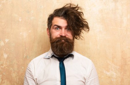 Foto de Funny haircut. Human facial expressions and emotions. Hipster man with funny hairstyle, modern haircut. Excited bearded man with beard, bearded gay - Imagen libre de derechos