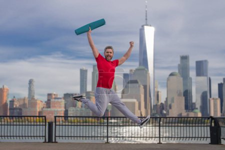 Photo for Man doing workout in NYC. Sports athlete doing workout practice for cardio wellness, physical fitness and training outdoor. Mature man workout senior man enjoying active lifestyle outside in New York - Royalty Free Image