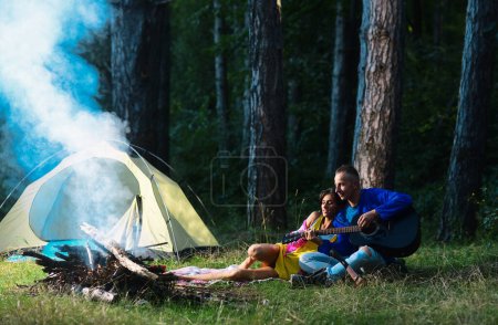 Photo for Hikers couple camping on nature. Romantic lovers on vacation camping. Sensual sexy couple on picnic, camping lifestyle with girlfriend - Royalty Free Image