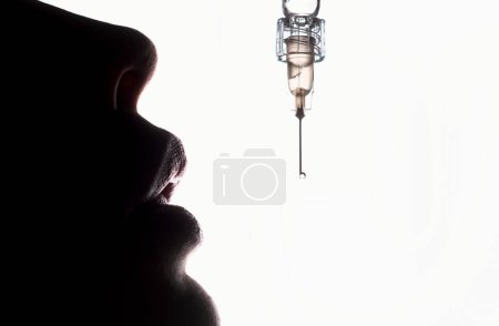 Photo for Syringe with medication, closeup. Vaccination and immunization. Vaccine and vaccinate. Lips syringe female mouth. Cosmetology Treatment. Lip augmentation. Hyaluronic acid injection - Royalty Free Image