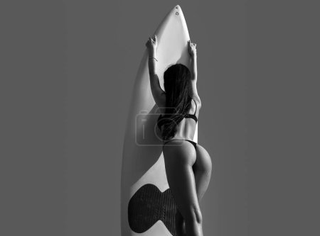 Photo for Bikini woman with serf board. Summer vacation concept. Sexy ass, butt or buttocks - Royalty Free Image