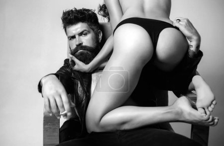 Photo for Woman nude posing with handsome muscular man. Fashion. Passion and sensual touch. Woman in sexy lingerie. Young. Couple in love on grey background. Fashion studio photo of beautiful couple - Royalty Free Image