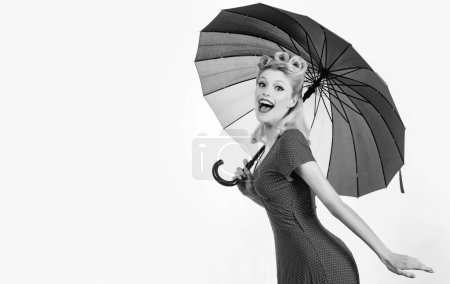 Photo for Happy pinup woman with umbrella at rainy weather. Rain rainbow autumn mood, pin up girl in red dress isolated white - Royalty Free Image
