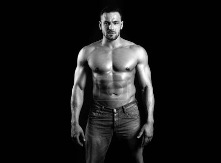 Photo for Muscular shirtless fashion male model. Strong man. Guy in vogue style on a black background. Young businessman. Athlete from a beautiful body. Beautiful young mans naked torso - Royalty Free Image