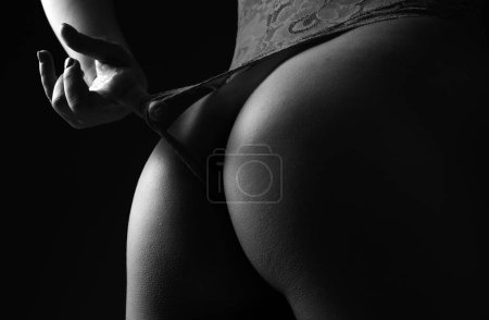 Foto de Sexy seductive lady in beautiful lingerie. Erotic girl fashion. Perfect sexy butt close up. Ideal womans butt and hips. Perfect anti-cellulite buttocks. Sexy butt with sensual touch - Imagen libre de derechos