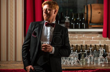 Photo for Old whiskey. Hipster drinking alcohol at bar. Stylish man at pub - Royalty Free Image