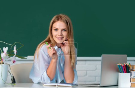 Photo for Portrait of smiling young college student studying in classroom. Education, high school, university, learning and people concept - Royalty Free Image