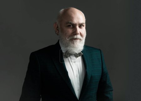 Photo for Confident senior bearded man in a suit and tie stand on gray isolated background. Fashion posing adult man in fashion suit - Royalty Free Image