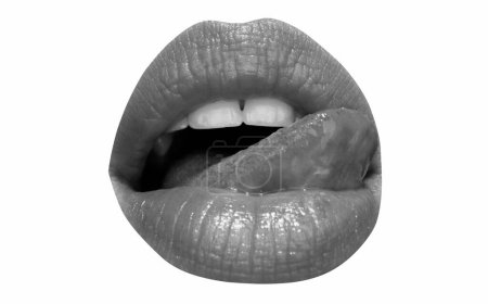 Téléchargez les photos : Isolated woman mouth and white teeth with tongue licking lips with red lipstick. Lick lip tongue, isolated on white - en image libre de droit