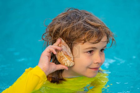 Photo for Kid listening to the ocean in a shell. Little boy holding a seashell close to his ear. Child play with shell at the beach. Kid having fun on summer holidays. Happy kids playing on sea - Royalty Free Image