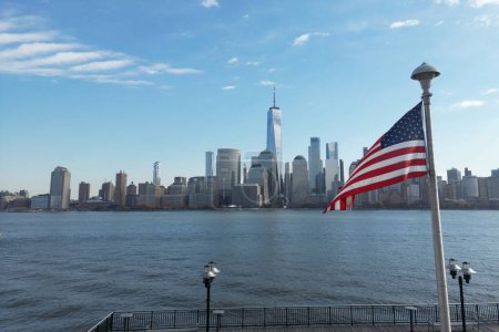Photo for USA flag in NY. US American flag on NYC from drone. American Memorial, Veterans Day, 4th of July. American Flag near New York City with Manhattan view. American Independence Day. Aerial View USA - Royalty Free Image