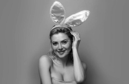 Photo for Young woman with bunny ears. Rabbit girl celebrating easter - Royalty Free Image