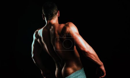 Foto de Hombre sexy con cuerpo musculoso y torso desnudo. Culo muscular, torso masculino. Ese es mi chico. - Imagen libre de derechos