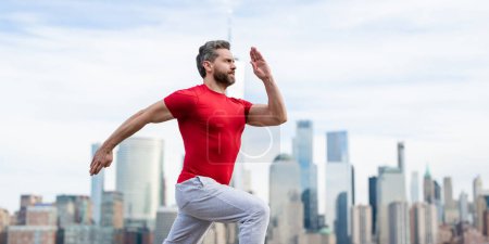 Photo for Man runner in sport outfit run in NYC. Motion, healthy run. Jogger run near Manhattan downtown. Muscular athlete sportsman run in city. Running sportswear. Handsome guy running workout outdoor - Royalty Free Image