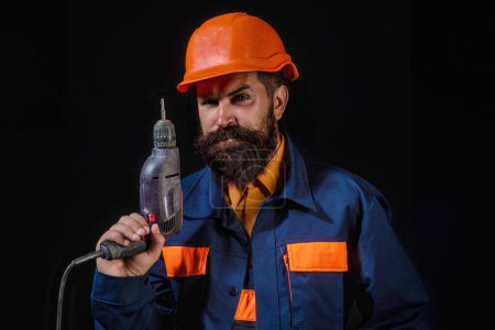 Photo for Builder in hardhat. Builder with helmet. Worker builder in helmet at building. Portrait of Builder with helmet and uniform - Royalty Free Image