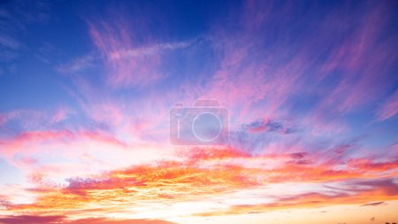 Photo for Sunrise background. Dramatic sunset background. Sky with clouds in Sunrise sky light background. Sunrise with clouds in various shapes background. Calm Sunrise - Royalty Free Image