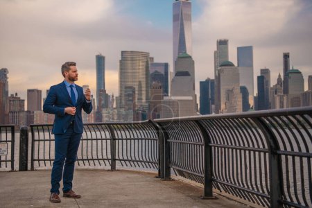 Photo for Successful businessman in NYC. Business man in New York. Businessman in suit outdoor. Portrait of an handsome businessman at urban style. Mature businessman walking on American street - Royalty Free Image