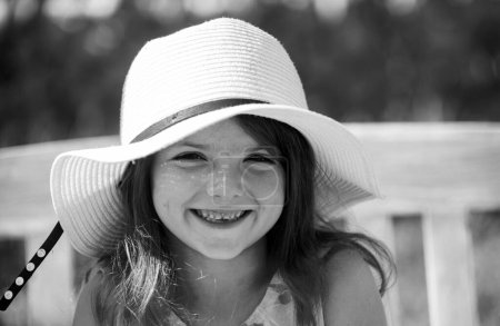 Photo for Smiling and laughing kids face closeup. Little girl outdoors, close-up. Portrait of attractive little teen with beautiful happy smiling face. Emotional portrait of a cheerful and positive smiling teen - Royalty Free Image