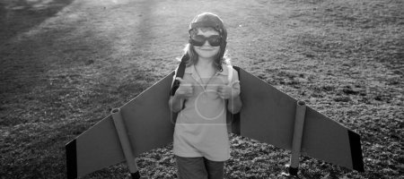 Photo for Child imagination dream to be pilot. Creative and innovation concept. Success kids and leader concept. Boy dreams of flying. Carefree child playing outdoors - Royalty Free Image