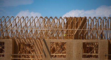 Photo for Timber home framing. Roofing construction. Wooden construction. A frame of a house. The frame of the cottage. The beginning of the construction of the house. Construction site - Royalty Free Image