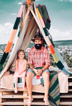 Photo for Family summer vacation. Camping time. Dad with children daughter. Father with daughter playing in tent. Summer outdoor. Fathers day - Royalty Free Image