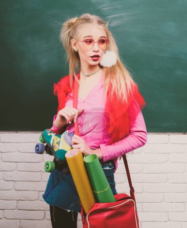 Photo for Portrait of a teen female student, charming teenager younf school girl with wearing funny eyeglasses and backpack - Royalty Free Image