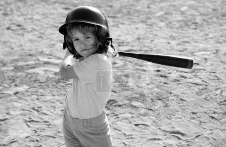Photo for Boy in baseball helmet and baseball bat ready to bat - Royalty Free Image