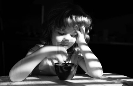 Photo for Healthy eating habits. Kids home food. Boy eats breakfast at kitchen. Children Nutrition - Royalty Free Image