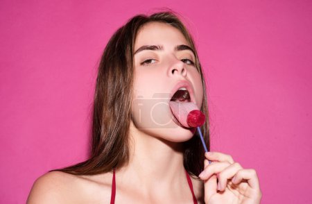 Photo for Seduction woman licking lollipop, art banner, red lips with lollipop. Sexy red female mouth and tongue with lolli pop. Art print for design - Royalty Free Image