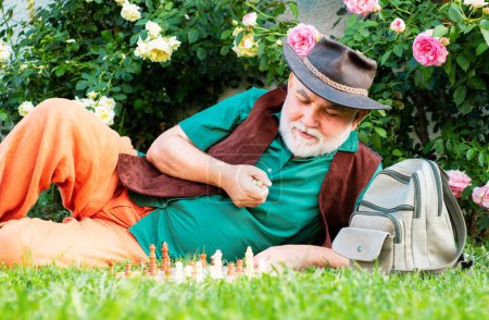 Photo for Nursing home. Old man relaxing with chess in garden. Mature male outdoor - Royalty Free Image